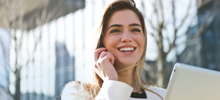 Person smiling while on the phone