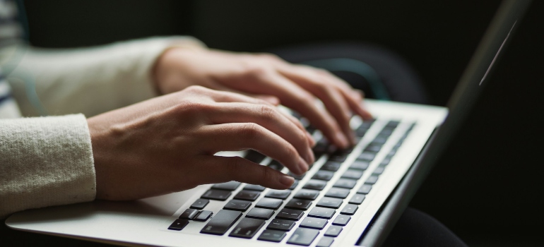 Person reading a moving guide to Philadelphia suburbs