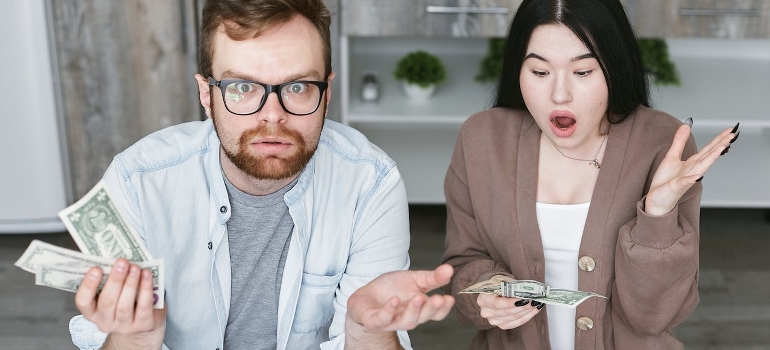 couple counting money after moving from Bala Cynwyd to Exton