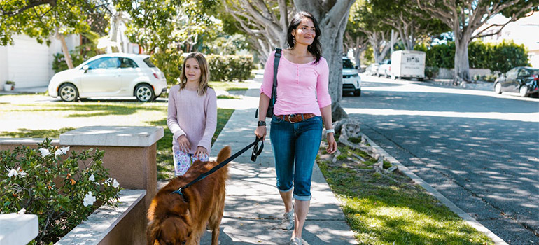 mom and kid walking a dog in Bryn Mawr