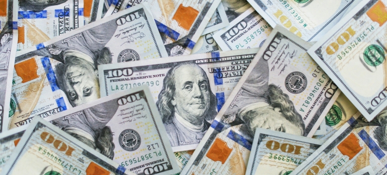 pile of cash needed after reading a family guide to moving to West Chester