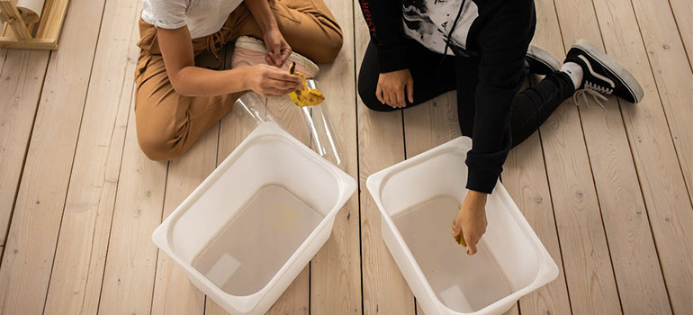 using plastic bins to store Halloween props